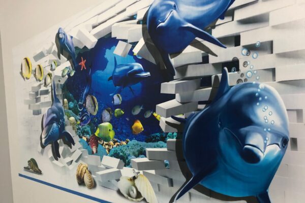 Close up image of dolphin wall art being printed by Wallprint NZ printing machine in Christchurch, Canterbury, New Zealand